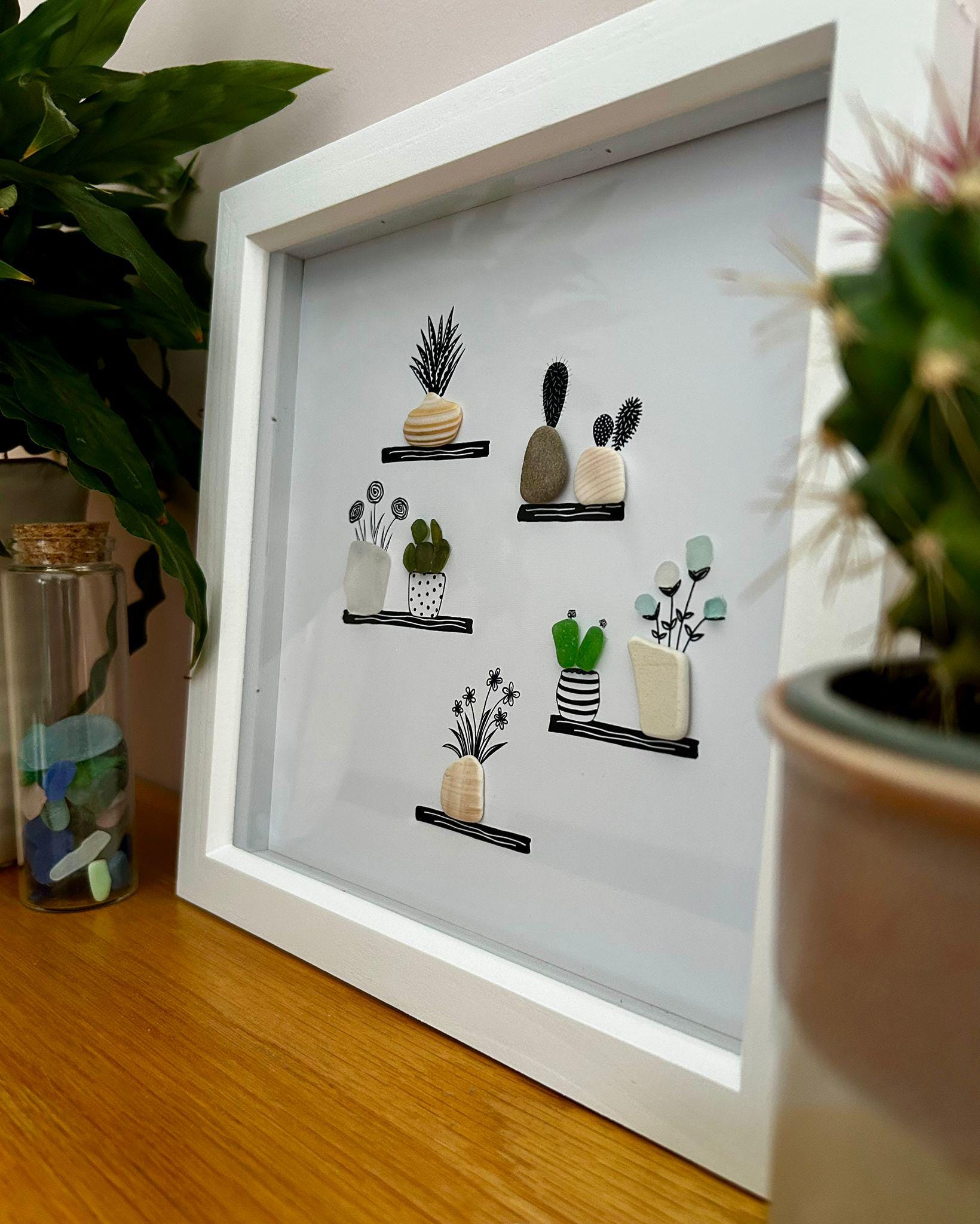 Sea Glass Flower & Pebble Plant Shelf Art – Handmade Coastal Wall Decor – Quirky Nature Picture