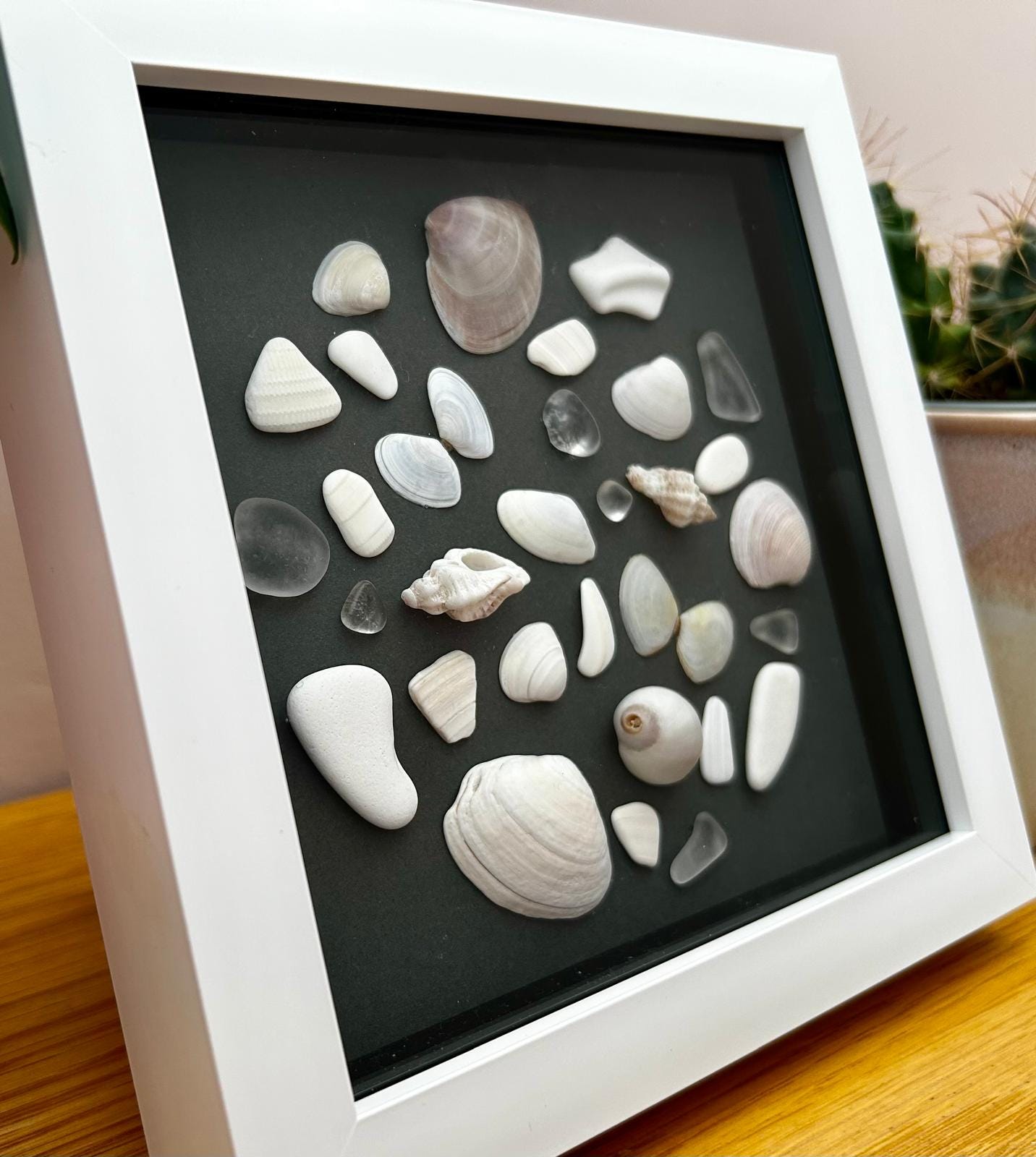 Handmade Cornish Sea glass, shells & pottery: Coastal Wall Decor in White Frame circle design