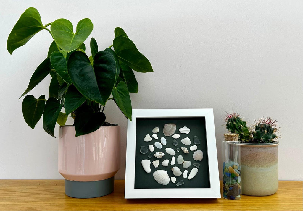 Handmade Cornish Sea glass, shells & pottery: Coastal Wall Decor in White Frame circle design